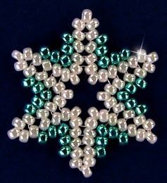 a green and white beaded snowflake ornament