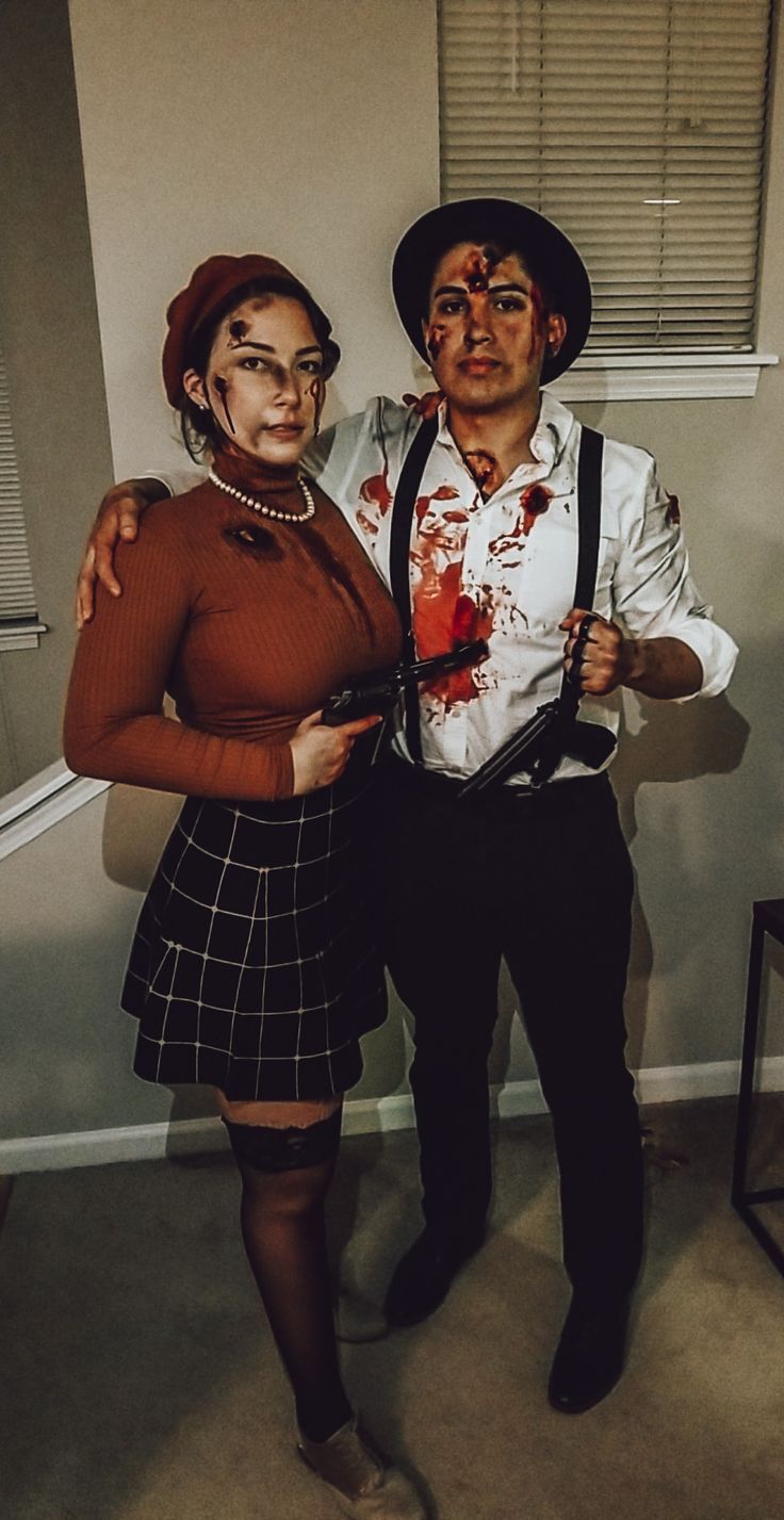 a man and woman dressed up as zombies