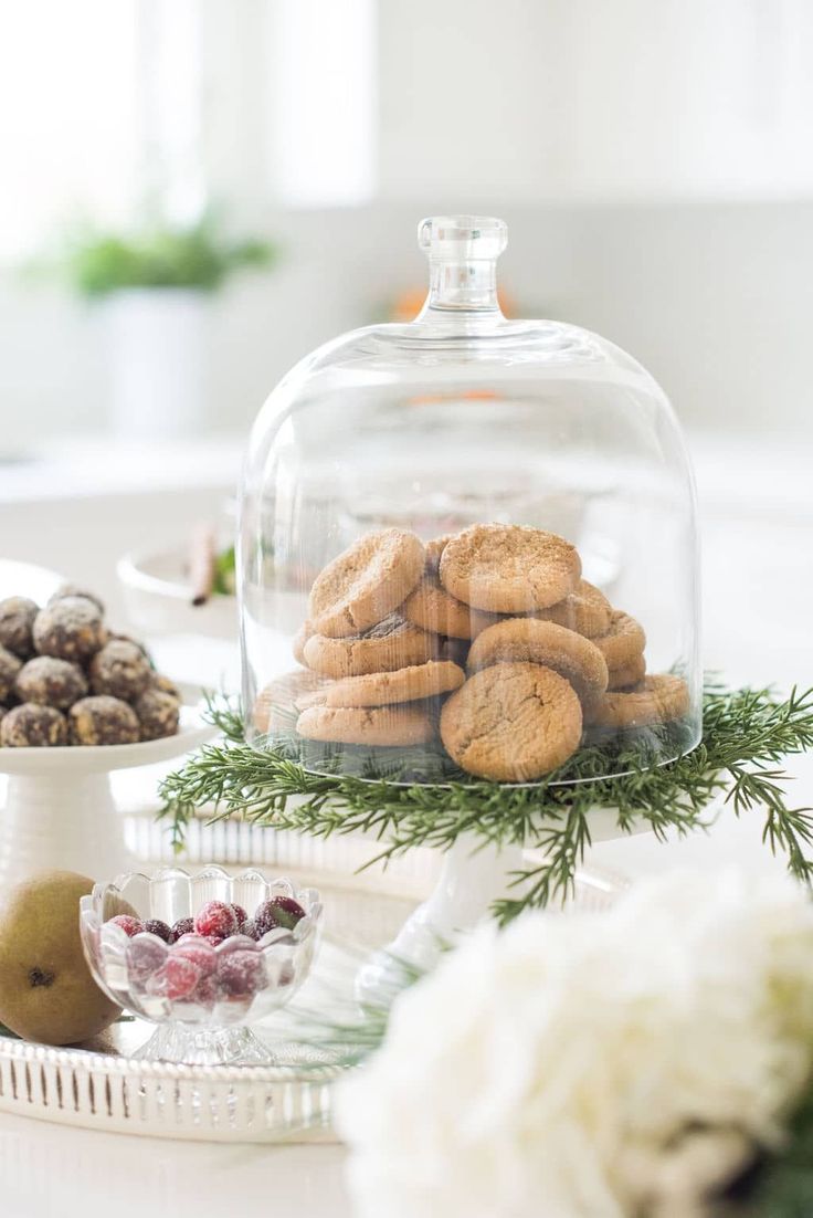 cookies and other treats under a glass clochel