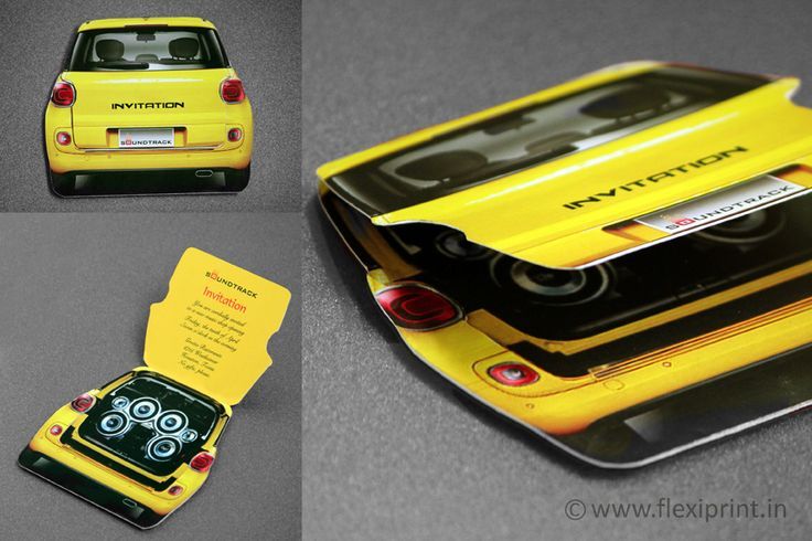 a yellow and black cell phone case sitting on top of a gray table next to a car