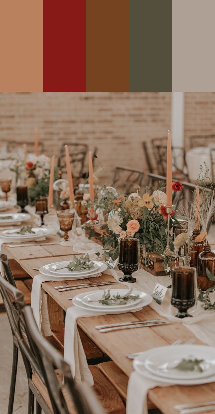 the table is set with candles, plates and napkins for an elegant wedding reception