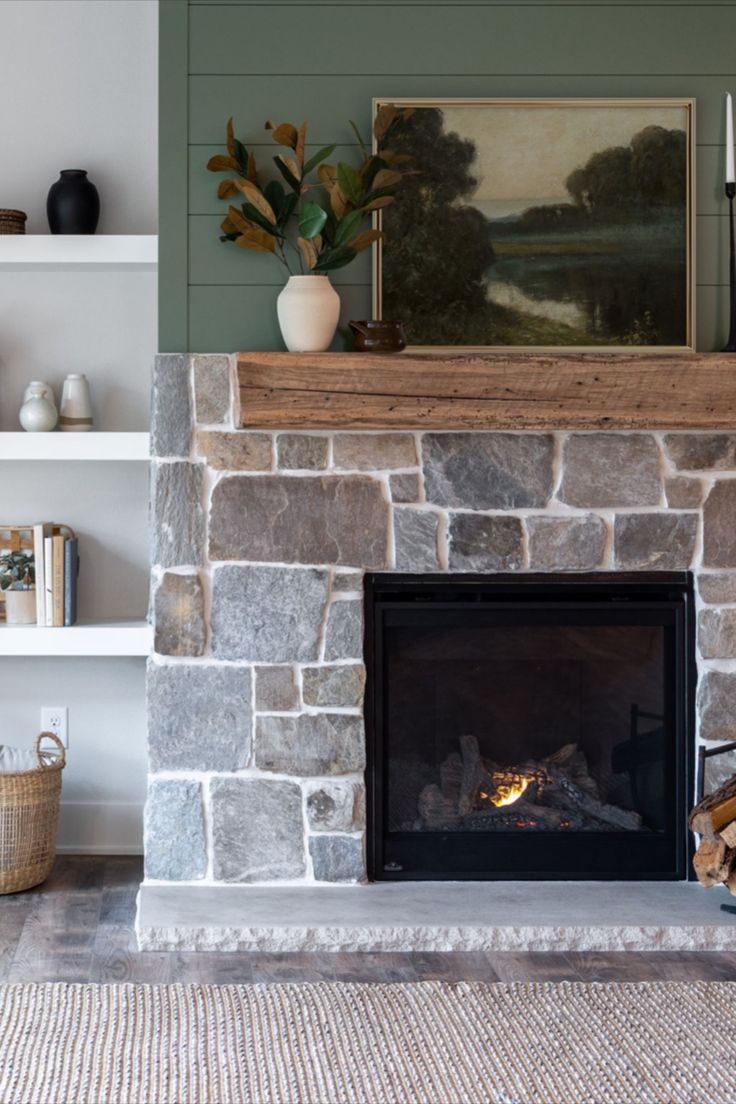 a living room with a fire place and bookshelves