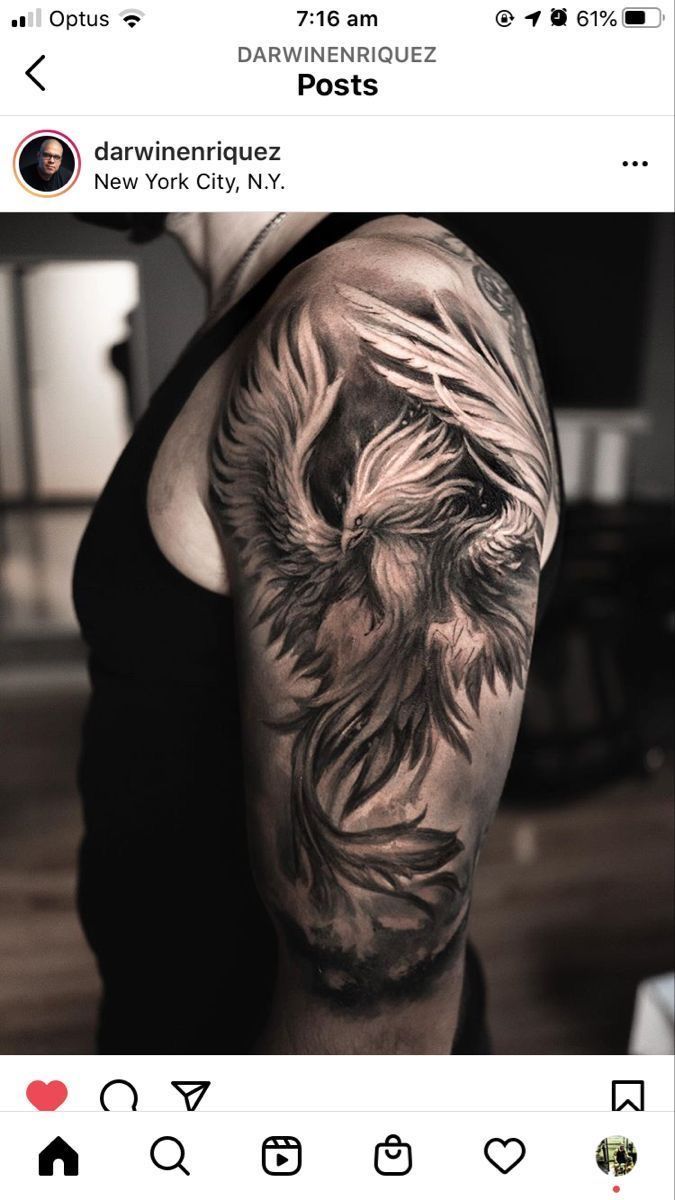 a man's arm with an eagle tattoo on it