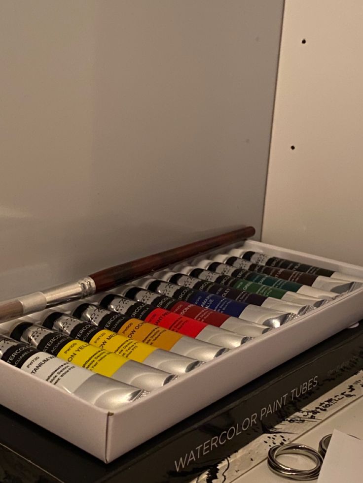 an assortment of watercolor paints in a box