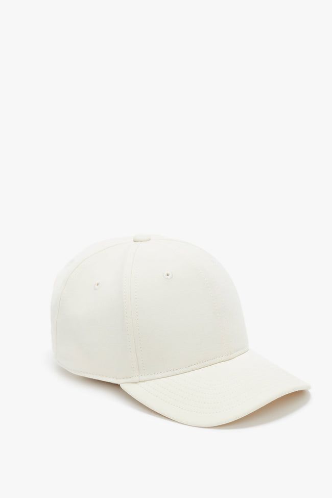 A refined take on athleisure wear, this Logo Cap in elegant Antique White is crafted from luxurious wool crepe. It has a discreet red embroidered VB logo at the back and VB printed logo tape on the interior and an adjustable plastic snap at the back for absolute comfort. Victoria Beckham Logo Cap In Antique White  - Size ONE SIZE UK Classic Solid Baseball Cap, Classic Baseball Cap With Curved Bill, Classic Solid Color Baseball Cap, Classic Visor Baseball Cap With Embroidered Logo, Classic Adjustable Cream Baseball Cap, Classic Baseball Cap With Curved Brim, Classic Fitted Hat With Embroidered Logo And Curved Brim, Classic Cream Baseball Cap With Curved Visor, Classic Fitted Hat With Curved Brim And Embroidered Logo