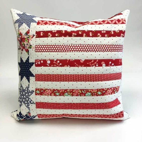 a red, white and blue pillow with stars on it