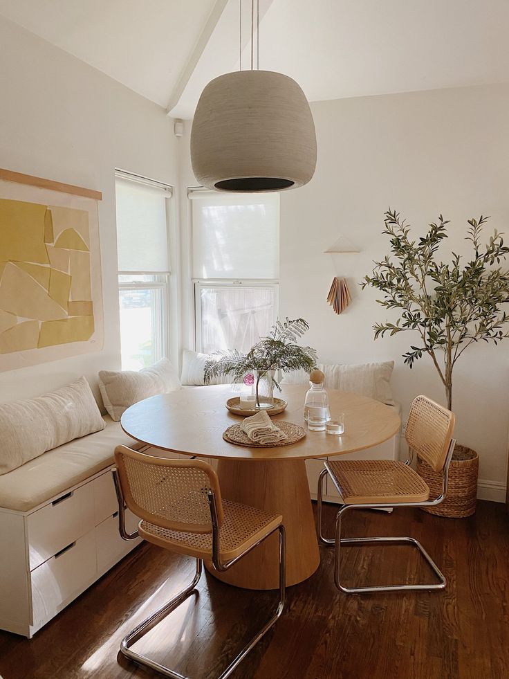 a living area with a couch, table and chairs