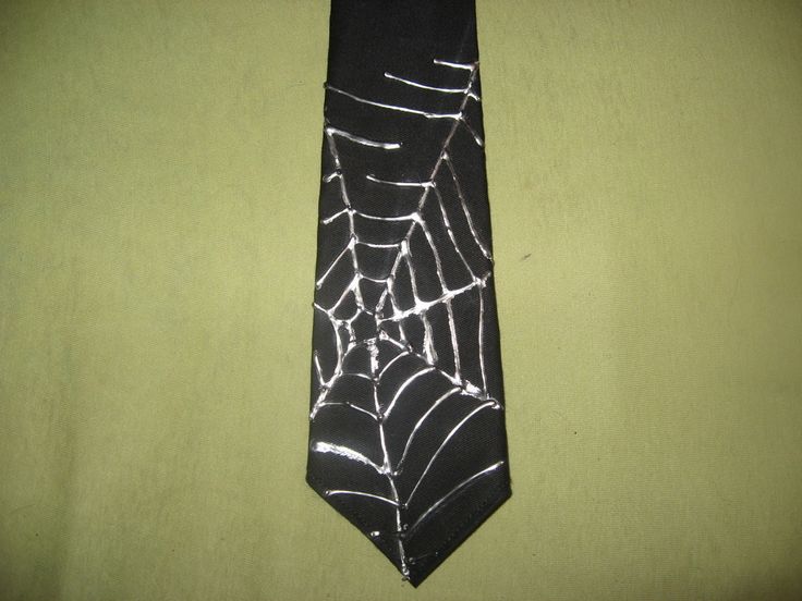 a black tie with white spider web on it