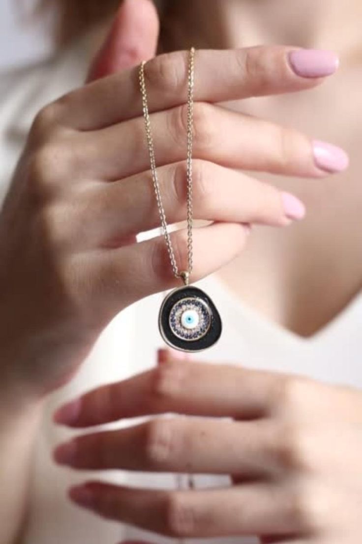 A meaningful and special gift for yourself and others! Black evil eye necklaces protect you and your loved ones. 🥰 DETAILS: - 14K Gold Plated Brass - AAA Best Quality Cubic Zirconia Stones - Dainty and non-Faded Chain ( Chain length: 20 inches; 16" + 4" extender ) - Our Turkish jewelry has a round shape. Diameter is 0.75". A Quarter Coin has 0.95" diameter. SHIPPING: -Free domestic shipping on all orders. All items are shipped with First Class USPS with tracking. Black Personalized Pendant Necklaces, Personalized Black Pendant Necklaces, Spiritual Black Necklaces For Party, Black Clavicle Chain Necklace As Gift, Personalized Spiritual Black Necklaces, Personalized Black Spiritual Necklaces, Personalized Black Spiritual Jewelry, Personalized Black Round Pendant Jewelry, Personalized Black Jewelry For Party