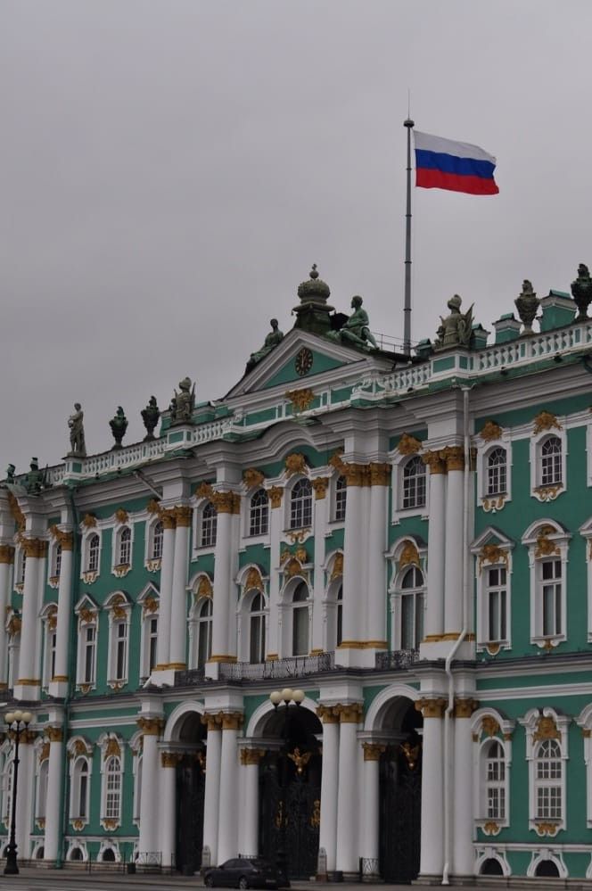 an old building with a flag on top