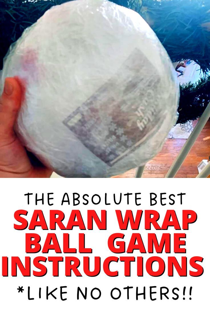 someone holding up a plastic wrap ball in front of a christmas tree with the words, the absolute best saran wrap ball game instructions like no others