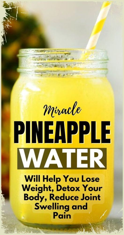 a mason jar filled with pineapple water and a yellow striped straw sticking out of it