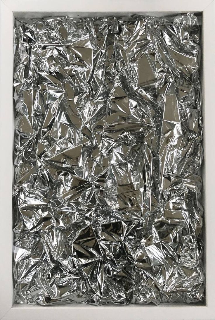 an abstract painting with silver foil covering the entire frame and bottom part of the image