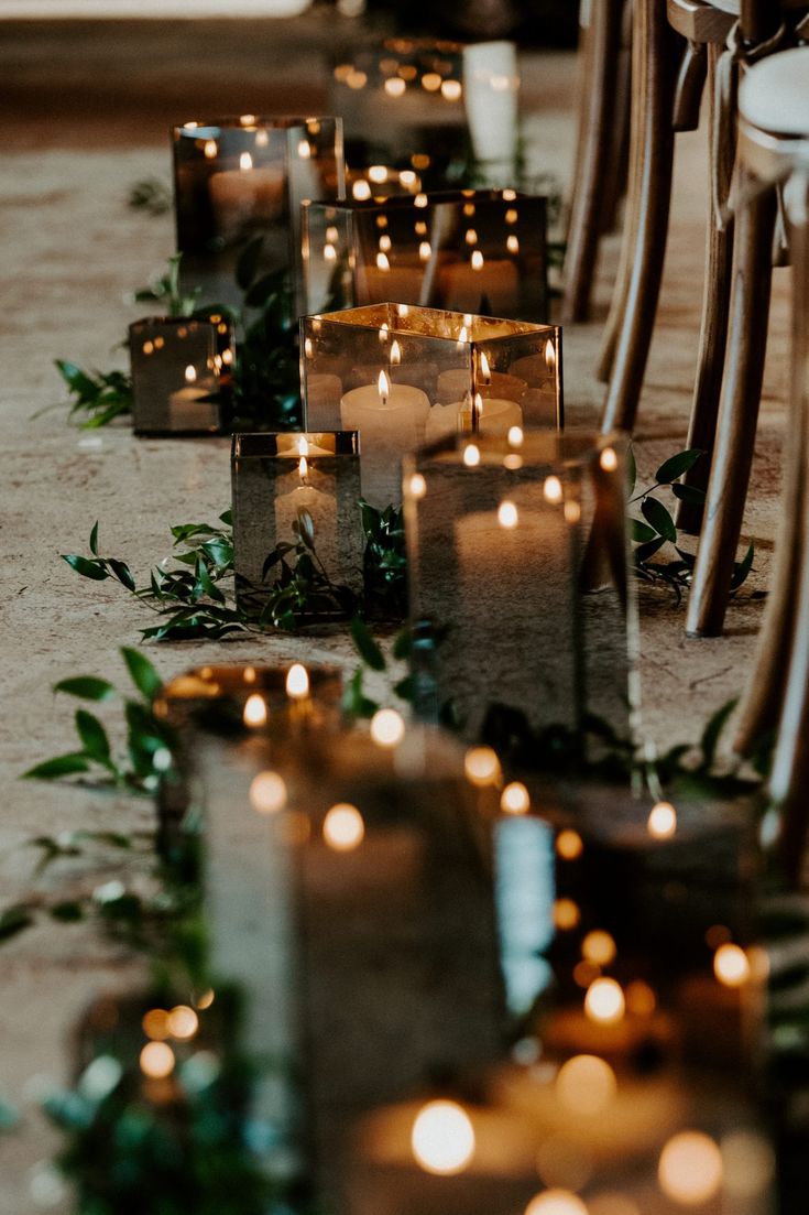 rows of candles are lined up on the floor