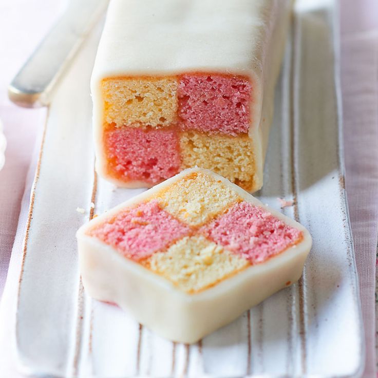 two pieces of cake sitting on top of a white plate