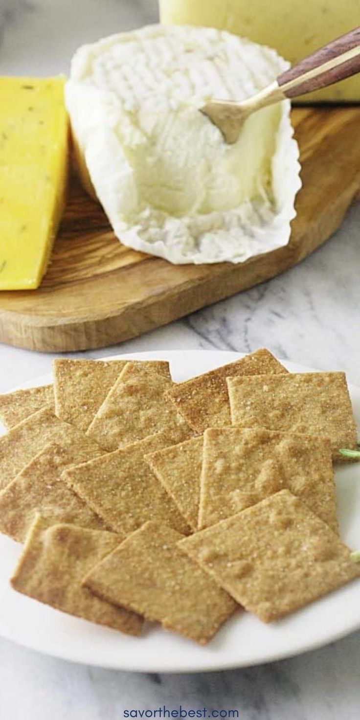 crackers and cheese are on a plate