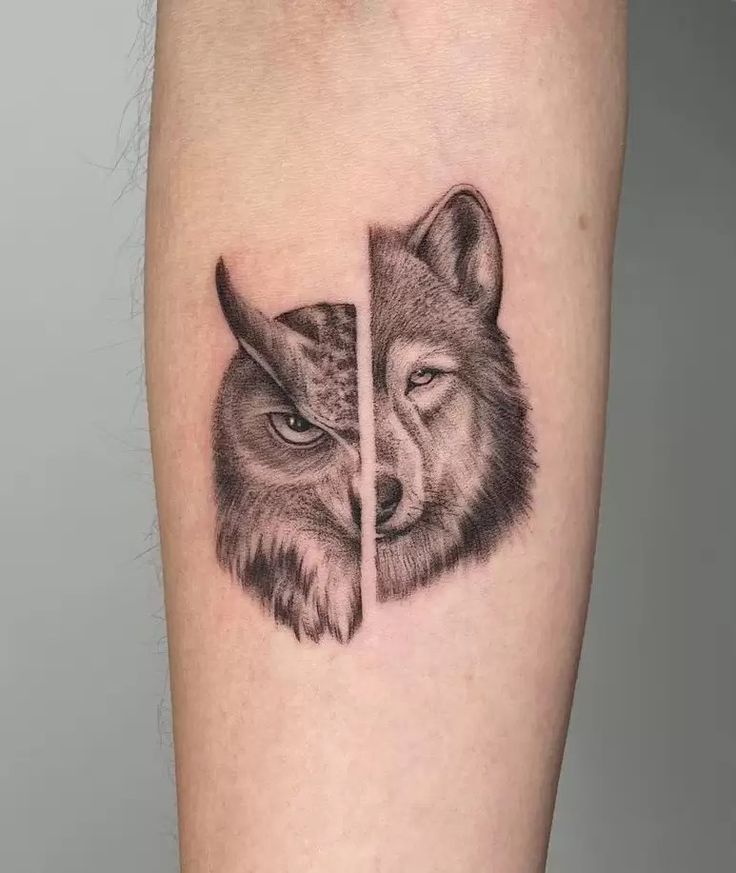 two wolf tattoos on the arm