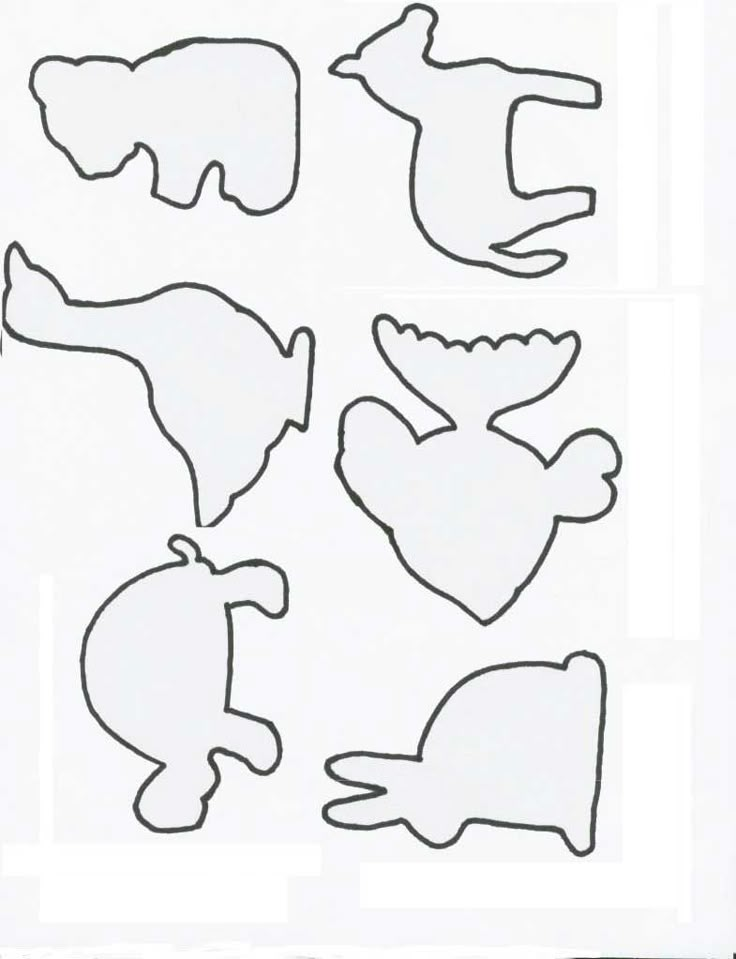 the cut out shapes are shown in black and white, including an elephant, whale, bear