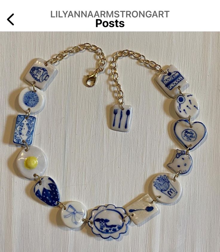 a blue and white bracelet with charms on it