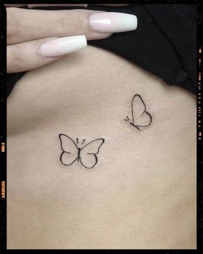 image Small Black Butterfly Tattoo Simple, First Tattoo Ideas For Women Butterfly, Butterfly Wrist Tattoos For Women Simple, Plain Butterfly Tattoo, Simple Butterfly Tattoos For Women, Simple Butterfly Tattoo Design For Women, Small Outline Butterfly Tattoo, Small White Butterfly Tattoo, Butterfly Outline Tattoo Simple