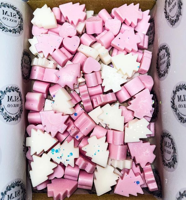 a box filled with lots of pink and white candies