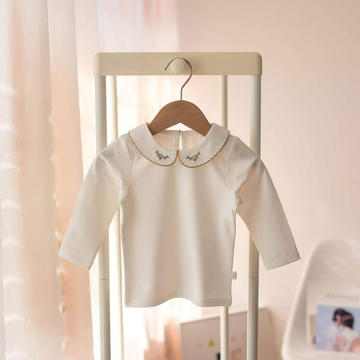 This sweet and lovely white long sleeve top is perfect for any day. Featuring embroidered cute design on the collar to make it extra special. It is soft, comfy, and made of lightweight fabric that best suits your little girls. Grab this comfy-casual choice for any kind of weather. Material: COTTON Sleeve Length(cm): Full Fit: Fits true to size, take your normal size Fabric Type: Knitted Pattern Type: Solid Age Length inch cm 6-12M 12.5 32 1-2Y 13.5 34.5 2-3Y 14.5 37 3-4Y 15.5 39.5 4-5 16.5 42 *P White Long Sleeve Top, Cute Design, Embroidered Blouse, Comfy Casual, Cool Suits, Blouse Styles, Knit Patterns, White Long Sleeve, Suits You