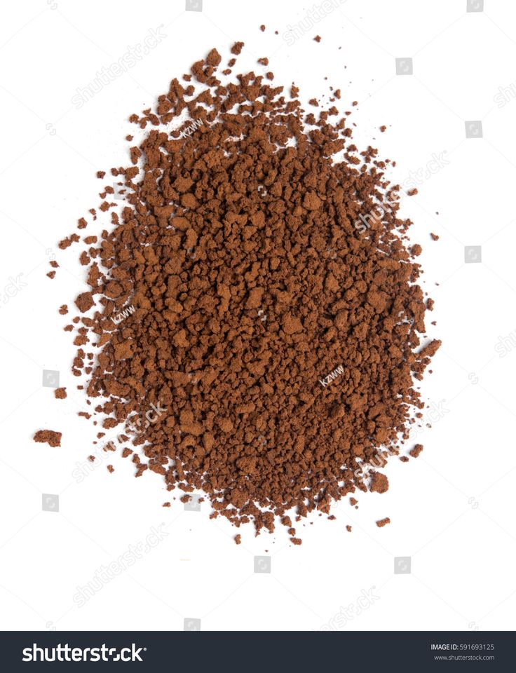 a pile of ground coffee on a white background