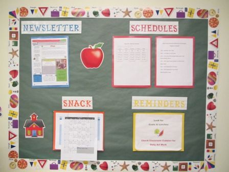 a bulletin board with some writing on it and an apple in the middle, surrounded by school supplies