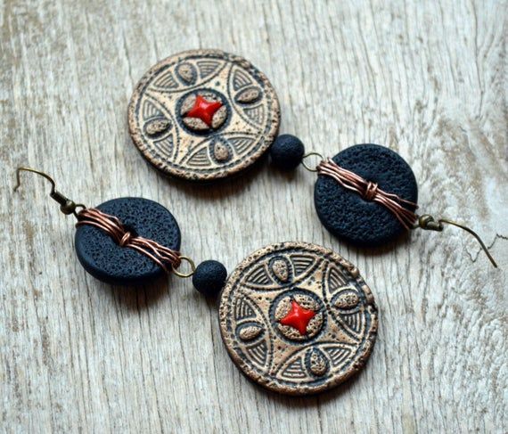 These long dangle earrings in bronze and black color are inspired by tribal jewelry and made of polymer clay imitating the old metal and lava beads.The elements made of copper wire make them more  ethnic looking, unique and unusual.This is a really statement piece of jewelry for women that can be an accent of your outfit or a great gift for her.Earring width: 3 cm (1.2")Earring length: 6.5 cm (1.6") not counting the hook wire.Can be made in different sizes and colors - please feel free to ask me Bohemian Black Jewelry Made Of Polymer Clay, Bohemian Bronze Earrings, Bohemian Black Polymer Clay Jewelry, Black Bohemian Polymer Clay Jewelry, Bohemian Multicolor Oxidized Finish Earrings, Taurus Pendant, Taurus Necklace, African Earrings Handmade Inspire Uplift ⭐, Old Metal