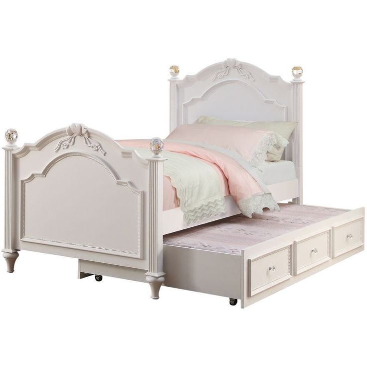 a white bed with drawers underneath it and a pink comforter on top of the bed