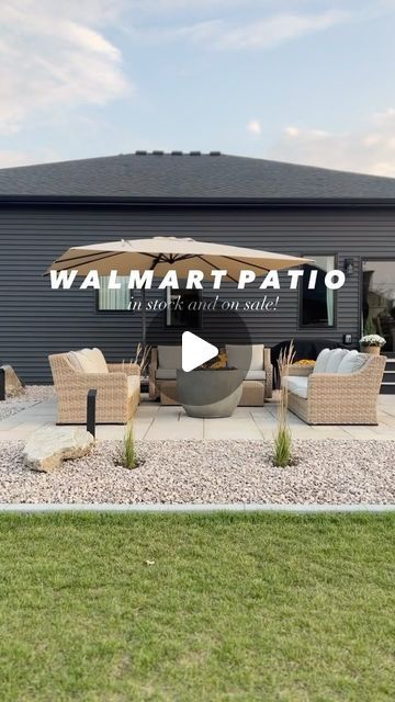 a patio with chairs and an umbrella in front of a building that says walmart patio