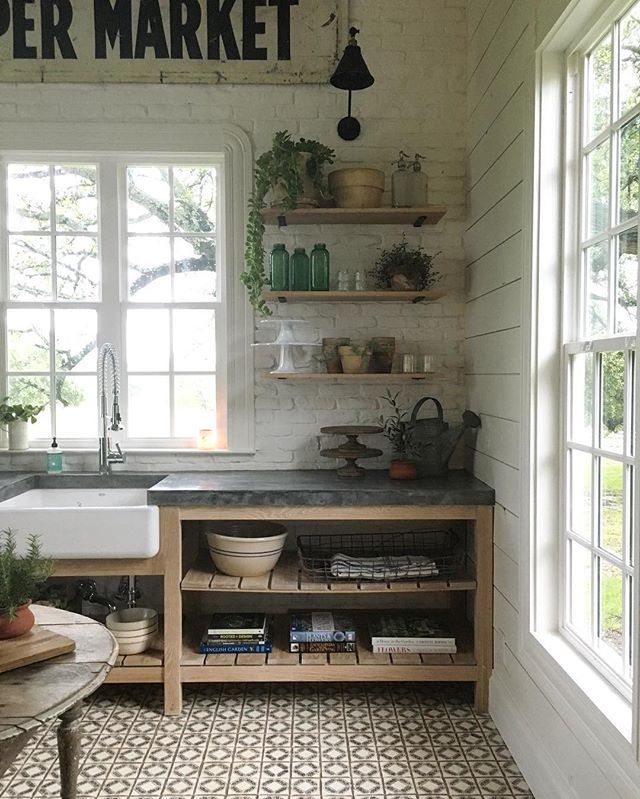 an instagramted photo of a kitchen with open shelving