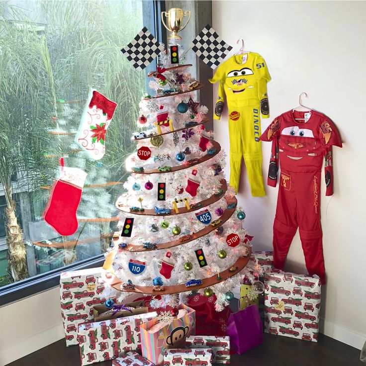 a christmas tree decorated with toys and gifts