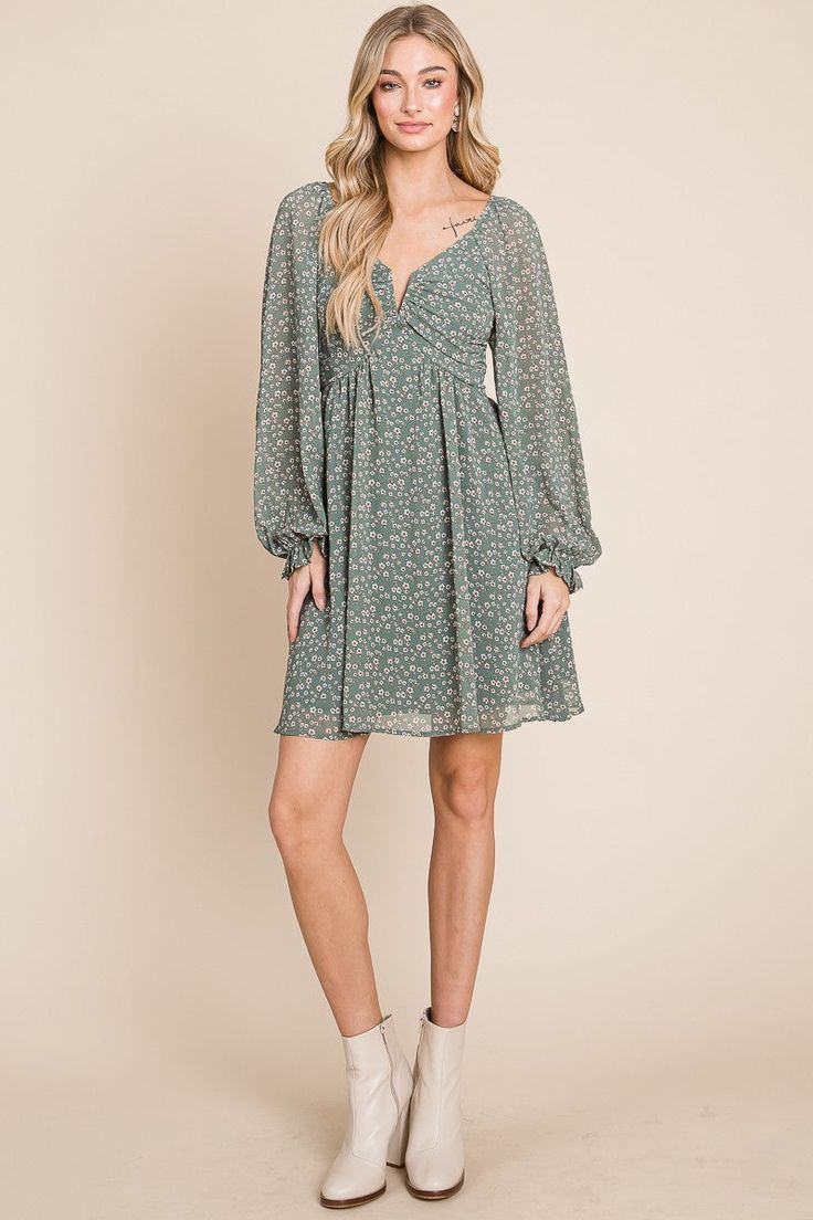 The perfect breezy dress to wear year-round, featuring a flattering draped fit, long sheer sleeves, split-neck detail, and open back. Material: 100% Polyester, 100% Rayon lining Chic Flowy Mini V-neck Dress, Chic Green Flowy V-neck Dress, Chic V-neck Chiffon Dress For Date Night, Chic Flowy Mini Length V-neck Dress, Flowy V-neck Dress With Surplice Neckline For Date Night, Chic Flowy V-neck Dress With Floral Print, Fitted Long Sleeve Chiffon Dress For Casual Wear, Chic V-neck Long Sleeve Dress With Gathered Sleeves, Chic Chiffon V-neck Midi Dress