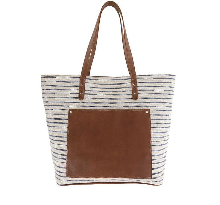 This trendy textile tote features a rich, full grain leather trim, plus leather bottom and straps for long-lasting wear. The spacious interior provides two zippers and accessory pockets, while a distinctive exterior leather pocket separates Shelby from your everyday totes, and keeps your phone and keys more readily at hand.
Handcrafted in the U.S.A. (15.00"W, 12.00"H, 6.00"D) On-the-go Satchel Bag With Leather Trim, Coated Canvas Shoulder Bag With Leather Handles, Brown Coated Canvas Bucket Bag With Leather Handles, On-the-go Satchel With Leather Trim And Double Handle, Leather Shoulder Bag With Leather Trim For Daily Use, Travel Weekender Bag With Coated Canvas Handles, On-the-go Travel Bag With Leather Trim And Double Handle, On-the-go Bucket Bag With Leather Handles, Canvas Bucket Bag With Leather Handles For Everyday Use