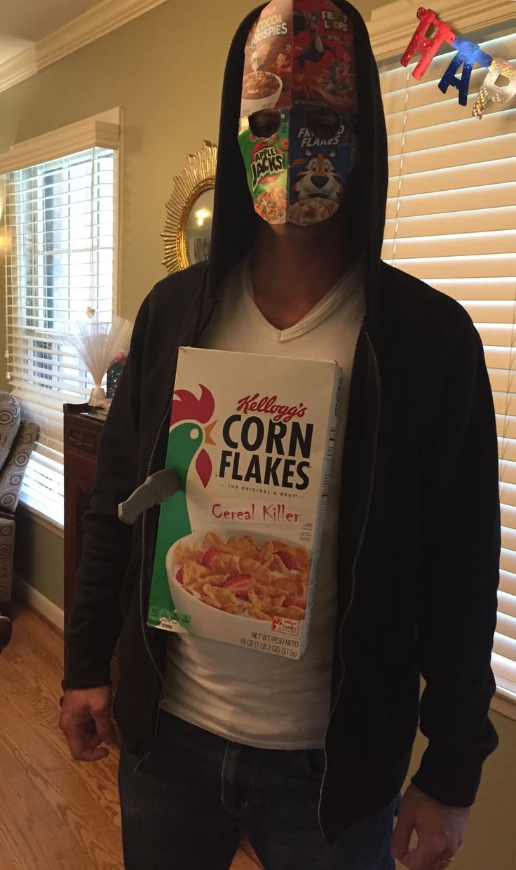 a man in a black hoodie is wearing a cereal box mask