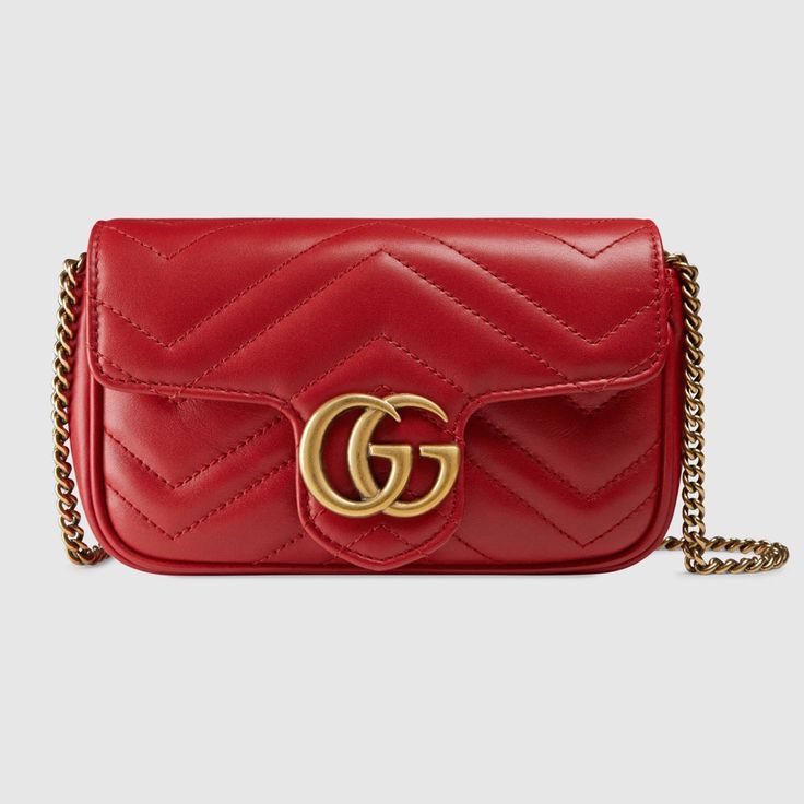 The Gg Marmont Mini Bag Has A Key Ring That Can Be Used To Attach It. Hibiscus Red Matelasse Chevron Leather With Hibiscus Red Leather Detail Gold-Toned Hardware Attached Key Ring That Can Attach To A Separate Bag Double G Chain Shoulder Strap With 23.5" Drop This Item Can Fit A Cell Phone Up To 2.7"W X 5.8"H X .3"D The Gucci Card Case Wallet Will Fit Inside This Product Weight: .35kg Approximately Super Mini Size: 6.5"W X 4"H X 2"D Made In Italy The Model Is 5'11" Tall Gg Marmont Mini Bag, Gucci Mini Bag, Gucci Marmont Mini, Cheap Designer Bags, Gucci Gg Marmont Matelasse, Gucci Mini, Gucci Gifts, Gucci Marmont, Gucci Gg Marmont