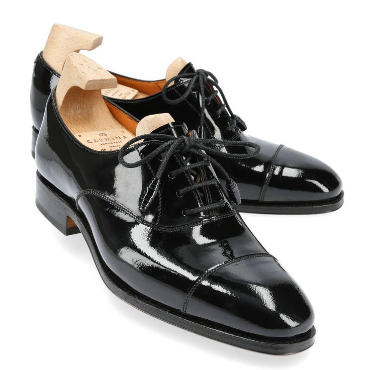 WOMEN'S OXFORDS IN BLACK PATENT LEATHER Designer Patent Leather Oxfords, Luxury Black Lace-up Shoes With Leather Sole, Luxury Black Wingtip Lace-up Shoes, Luxury Black Lace-up Shoes With Brogue Detailing, Black Oxford Dress Shoes With Leather Sole, Luxury Black Cap Toe Leather Shoes, Black Lace-up Shoes With Leather Lining And Almond Toe, Black Oxfords With Rubber Sole For Derby, Luxury Black Oxfords With Rubber Sole