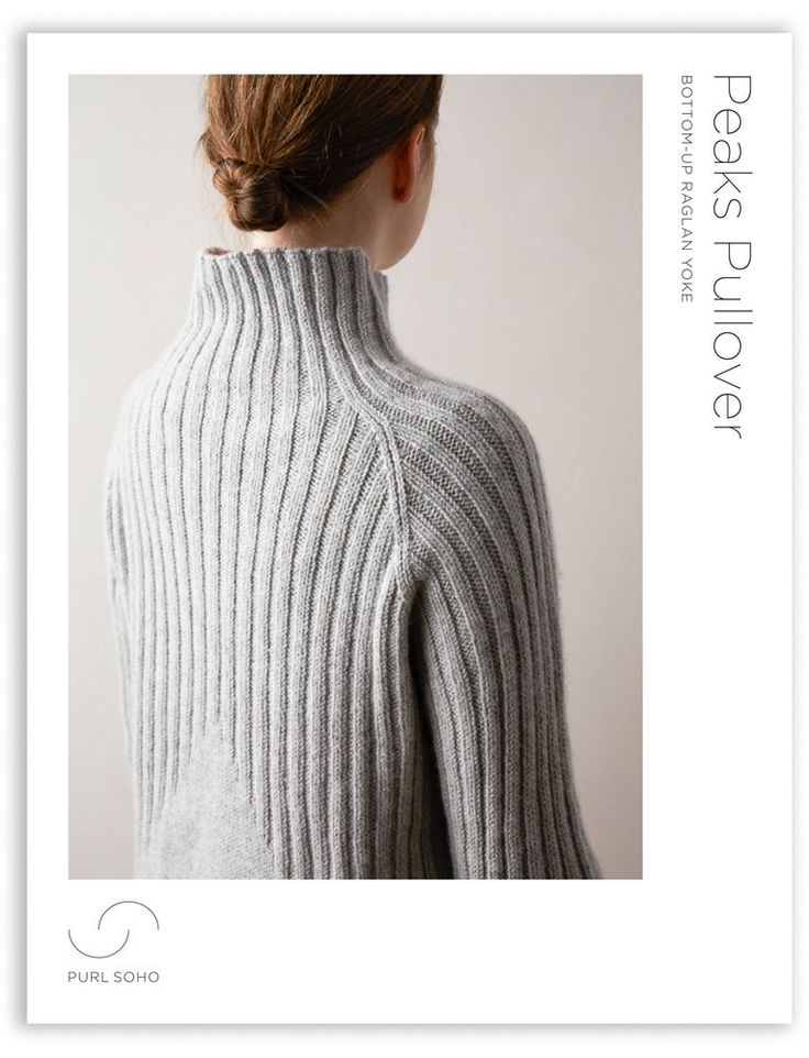 the back of a woman's sweater with an open neck and ribbings