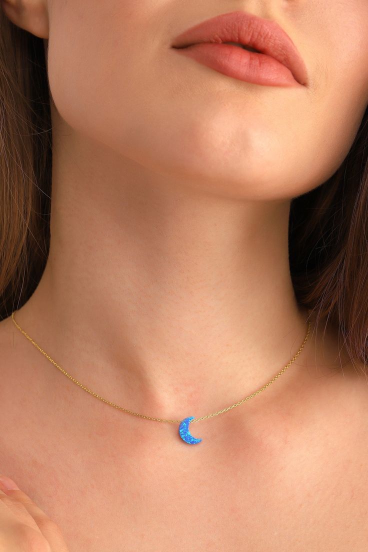 We creating this blue opal moon necklace necklace you see using 925 sterling silver and 14k gold. It is the perfect accessory that will suit your shine or make it feel special. It will be a unique gift that will add meaning to your precious days such as graduations, birthdays, mother's days, wedding events. If you like the personalized jewelry we have created for you, you can look at we other designs here: https://www.etsy.com/shop/DaintyPersonalizedCo Check out our social media @daintypersonali Blue Pendant Necklaces For Birthdays, Blue Pendant Necklaces For Birthday, Blue Moon Shaped Necklace For Gift, Blue Pendant Necklace For Birthday, Blue Moon Necklace For Gift, Elegant Blue Moon Shaped Necklace, Elegant Blue Moon-shaped Necklace, Dainty Blue Jewelry With Moon Charm, Dainty Blue Moon Charm Jewelry