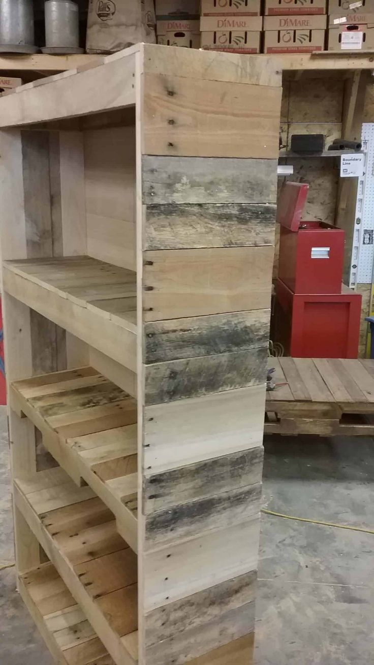 shelves made out of pallets in a warehouse