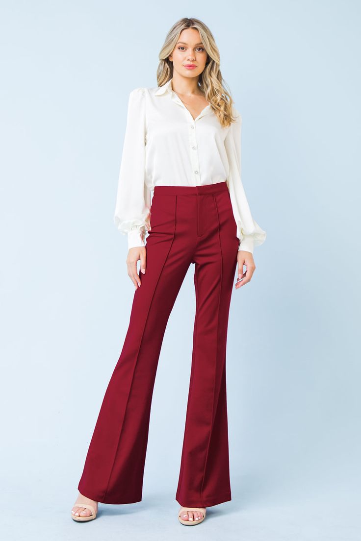 The DEPTHS OF BEAUTY FLARE PANTS combine sleek modern style with timeless sophistication. Crafted from a stretchy yet supportive blend of fabrics, the pants feature a high-rise waist and wide-leg fit, as well as front zipper/hook & eye closure, center seam, and faux back pockets. You'll look and feel stylish and confident all day long. Details Self: 97% Polyester 3% Spandex Size & Fit - Model is 5`8" And Wearing Size Small - Measurements Taken From Size Small - Approx. Length: 45" Elegant Flares For Night Out, Elegant Stretch Flares, Sleek Flare Pants For Fall, Elegant Flare Bottoms For Workwear, Elegant Wide Leg Stretch Flares, Modern Fitted Flares With Wide Leg, Elegant Stretch Flare Pants, Elegant Fitted Flare Pants, Modern Fitted Wide Leg Flares