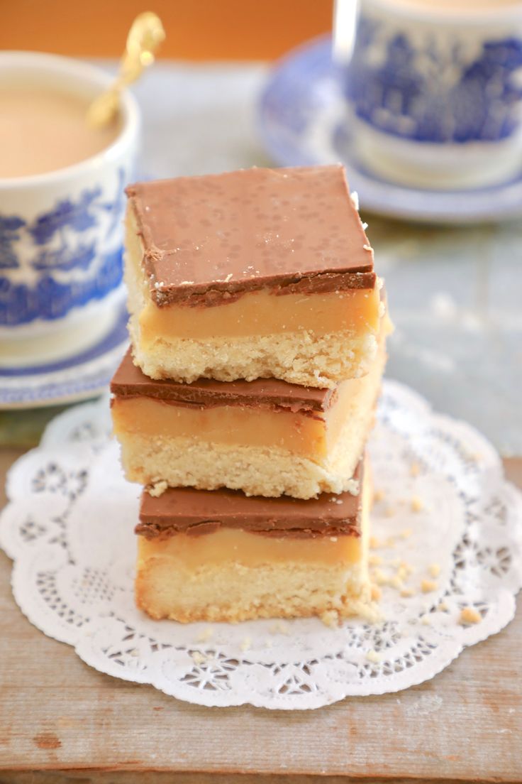 three pieces of cake sitting on top of a doily