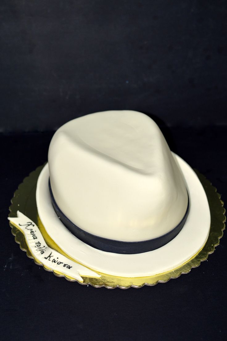 a white hat sitting on top of a plate