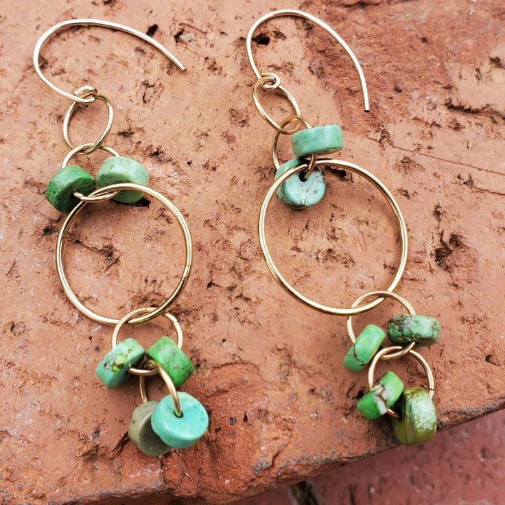 Stand out with these beautiful Sydney Dangle Earrings. These eye-catching earrings offer you so many ways to wear them. They are designed with the delightful green Heishi beads that are known for their colorful wheel. The fun loving Sydney Dangle Earrings will be your grab and go pair this season. 2x4 mm Heishi Beads 14k Gold-Filled Accents 2.5" Drop Perfect Gift Idea Fashion for all seasons Flirty Design Lightweight Bohemian style vibe Please note: Earrings appear larger on mannequins Green Hoop Earrings With Dangling Beads For Gift, Green Chandelier Earrings With Dangling Beads As A Gift, Green Nickel Free Dangle Earrings, Green Teardrop Hoop Earrings For Jewelry Making, Nickel-free Green Dangle Earrings, Green Hoop Beaded Earrings With Dangling Beads, Green Nickel-free Dangle Earrings, Nickel-free Green Drop Earrings, Green Nickel-free Drop Earrings