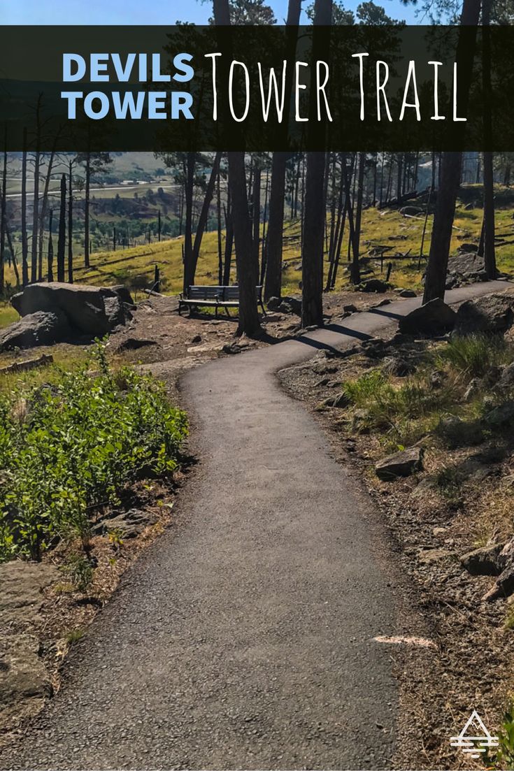 the devil's tower trail in devils tower state park, oregon with text overlaying it