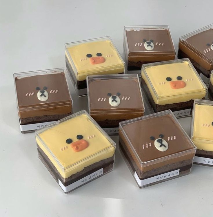 there are many square cakes with faces on them