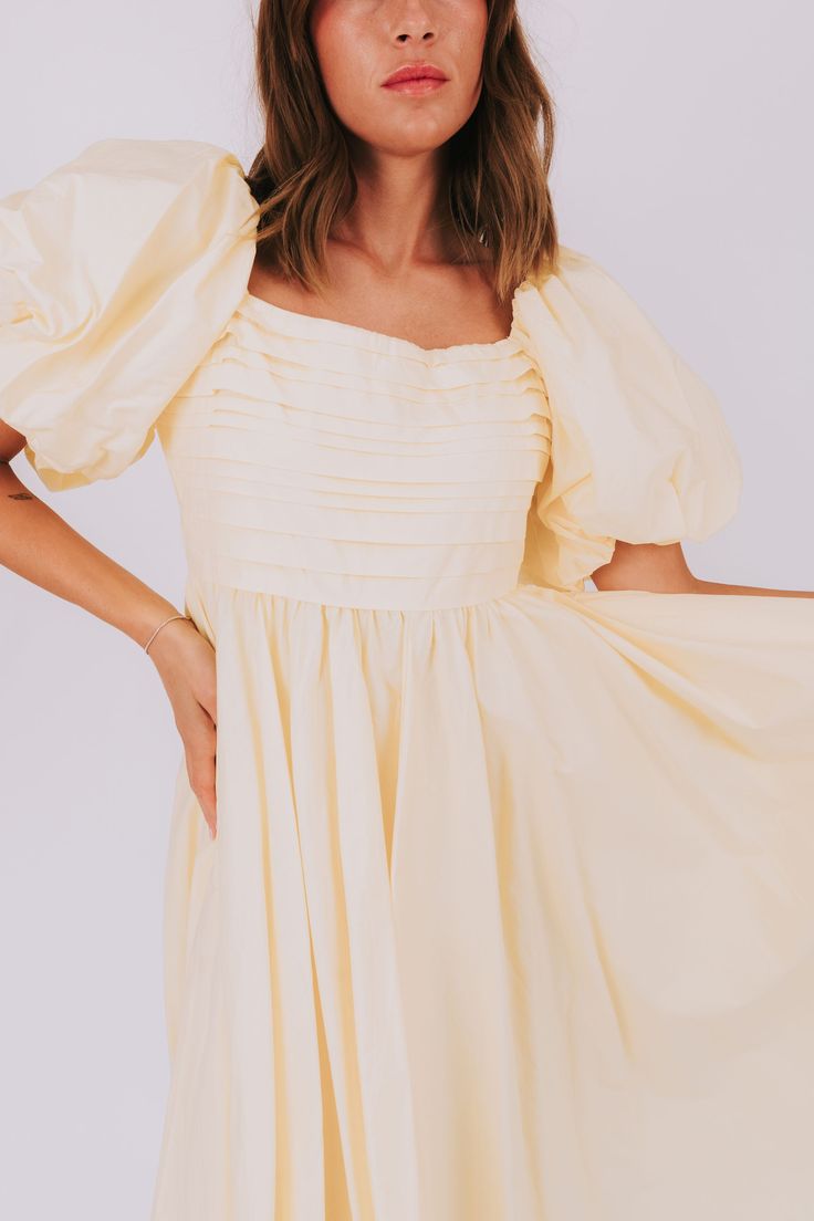 Have a slice of sweet style with our Lemon Meringue Dress! This dress will make you feel like a summer treat with its puffy sleeves, pleated bust, and square neckline. Perfect for sunny days and fun nights! Details Puffy sleeves Pleated bust Square neckline Lined to the knee Sizing Approximate measurements: SIZE LENGTH BUST Small 46" 36" Medium 47" 38" Large 50" 40" Fabric has no stretchModel is 5’8 wearing small Material Self 100% CottonLining 100% PolyesterHand wash coldHang to dry Summer Brunch Puff Sleeve Dress With Square Neck, Feminine Puff Sleeve Dress For Summer Brunch, Puff Sleeve Ruffle Dress For Day Out, Summer Puff Sleeve Mini Dress, Summer Square Neck Pleated Mini Dress, Summer Puff Sleeve Dress With Square Neck, Summer Pleated Mini Dress With Square Neck, Summer Mini Dress With Square Neck And Pleats, Billowy Short Sleeve Mini Dress For Summer