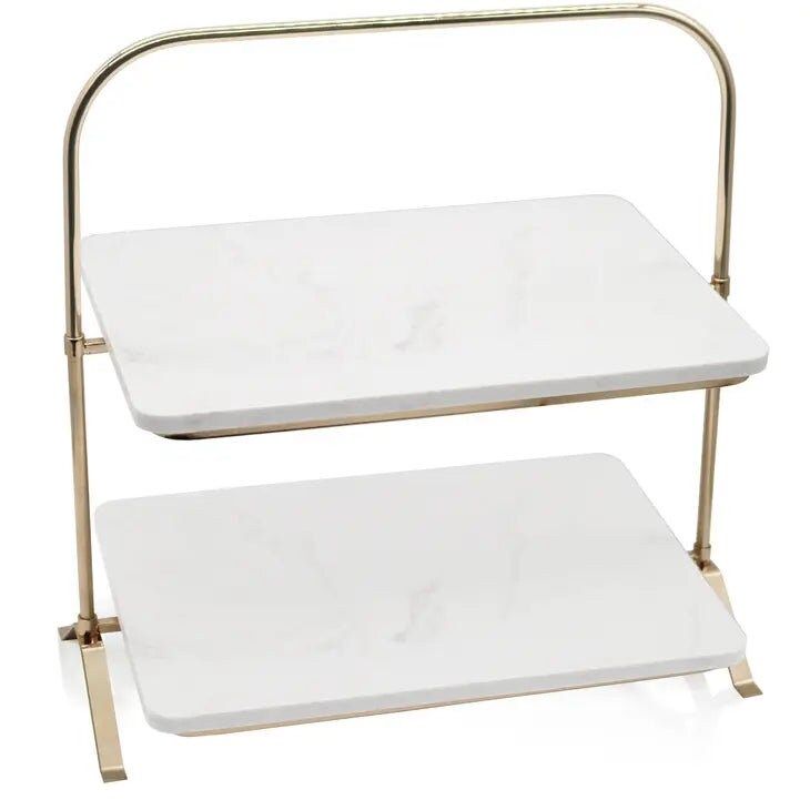 two tiered white marble trays with gold metal handles, one on each side