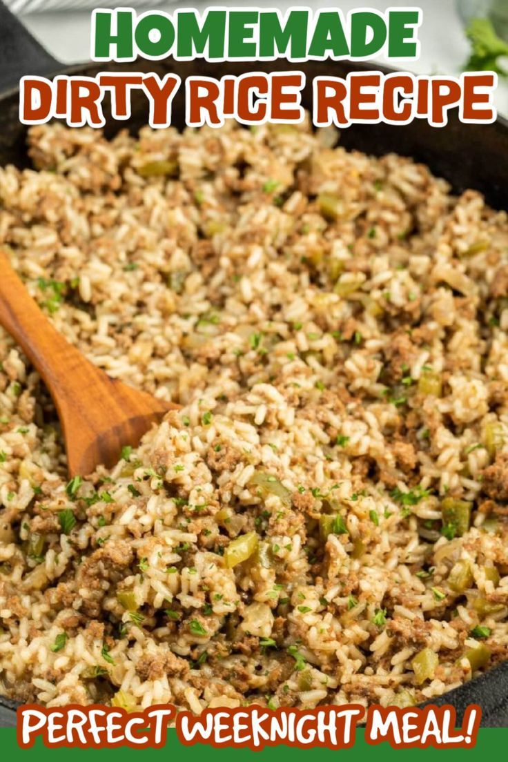 a skillet filled with rice and vegetables on top of a table next to a wooden spoon